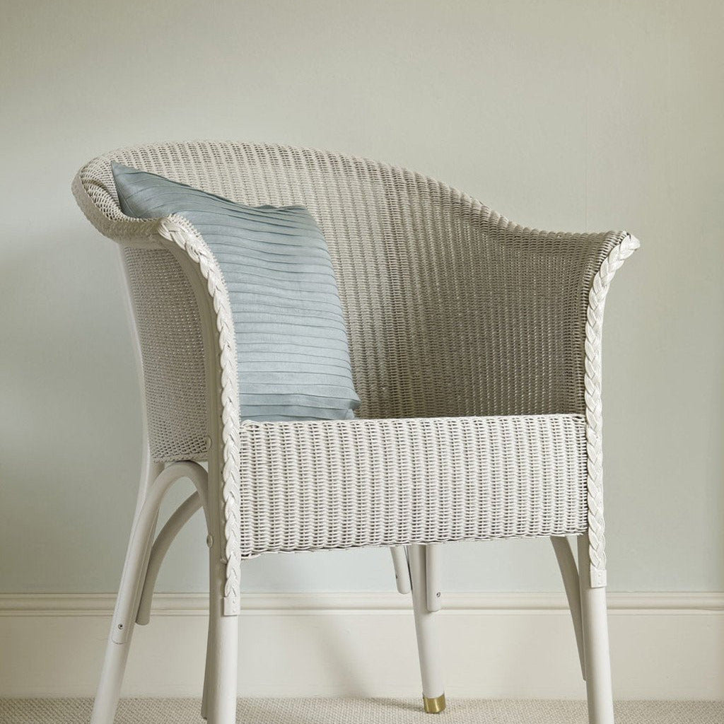 Wall painted in Farrow & Ball Pale Powder No.204 with wicker chair in front