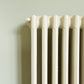 Wall painted in Farrow & Ball Blue Gray No.91 with white cast iron radiator in front.