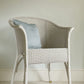 Wall painted in Farrow & Ball Pale Powder No.204 with wicker chair in front